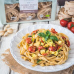 Wholemeal fettuccine with pistachio pesto, courgettes and confit cherry tomatoes